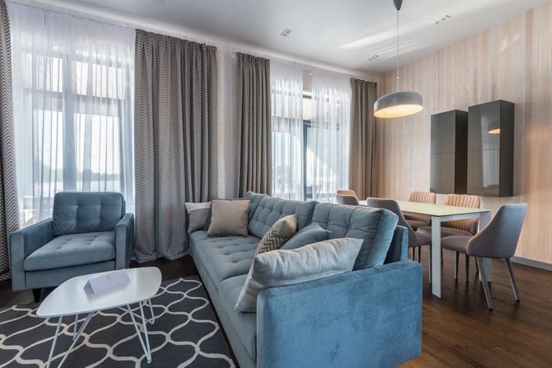 Cosy modern rental apartment living room with table lamp and plants