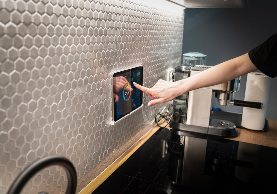 Wall-mounted tablet displaying a smart home dashboard with controls and sensors