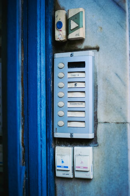 Wireless smart video doorbell mounted next to a front door